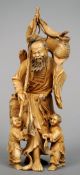 A 19th century Japanese ivory okimono 
The single piece figural group carved as a fisherman with his