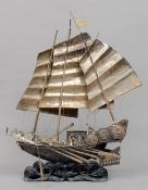 A 19th/20th century Chinese white metal model of a traditional Chinese junk
Modelled in full sail