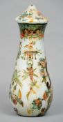 A 19th century Decalomania glass vase
The cover and baluster body chinoiserie decorated.  42 cms