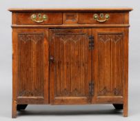 A 17th century and later oak side cabinet
The moulded rectangular top above a pair of frieze drawers