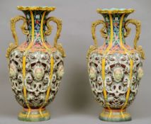 A pair of 19th century Continental maolica vases
Each with twin scrolling handles above the main
