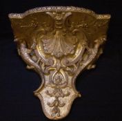 A 19th century carved giltwood wall bracket
Decorated with shell and C-scrolls and flowering