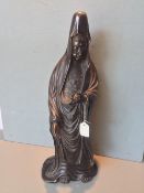 A Japanese bronze figure of Guanyin
Typically modelled, holding a scroll. 53 cms high.   CONDITION