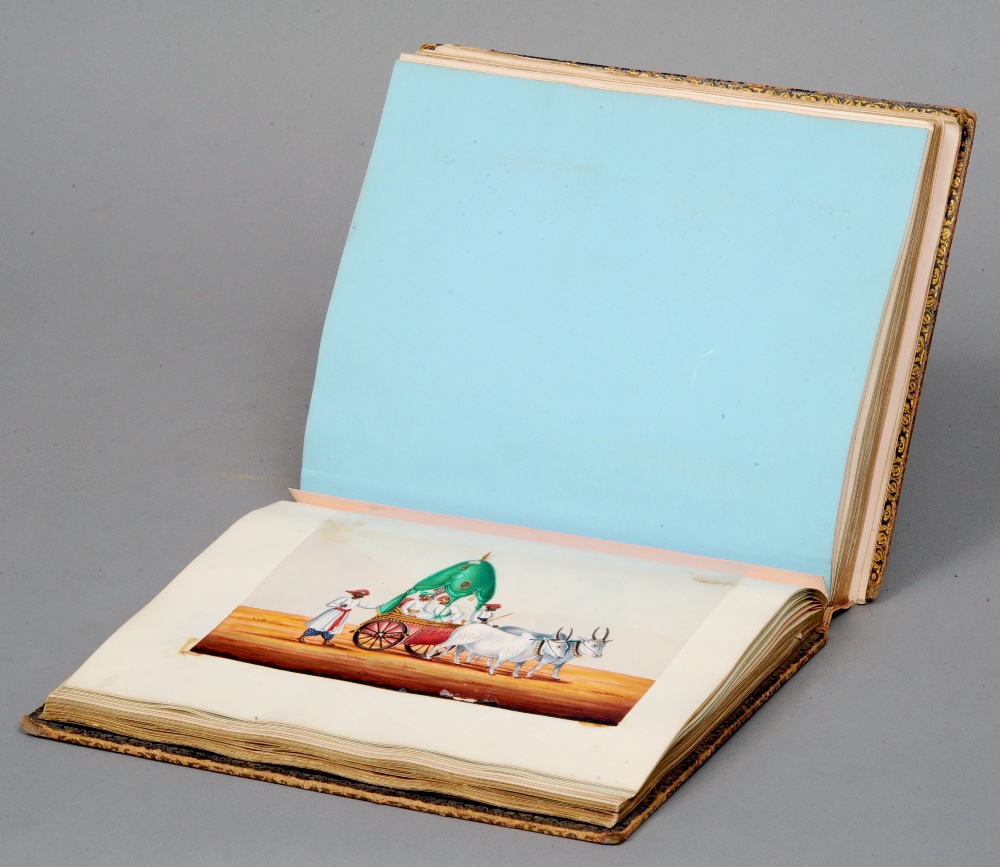 A Victorian leather bound scrap album
Containing numerous Indian oil paintings on acetate
