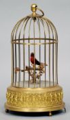 A bird cage form automaton
The brass cage enclosing a bird on a perch, the underside inscribed