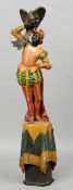 A Venetian painted carved wooden Blackamoor figure
Modelled in brightly coloured attire, one arm