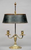 A gilt brass candle lamp
With twin branches and tole painted adjustable shade.  53 cms high overall.