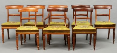 A set of eight Victorian mahogany dining chairs, including one with arms
Each curved top rail