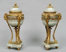 A good pair of 19th century ormolu mounted green variegated marble cassolets and covers
Each