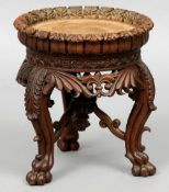 A 19th century Eastern carved hardwood urn stand
The dished acanthus carved top above a pierced