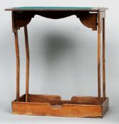 A 19th century Anglo-Indian hardwood campaign card table
The brass mounted hinged top enclosing a