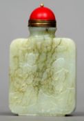 A Chinese carved jade snuff bottle
Carved to one side with Guanyin and a scholarly figure, the