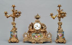 A 19th century French ormolu clock garniture
The barrel form movement with white dial with Roman