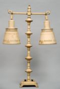 A painted tole ware table lamp, possibly American
With twin branches and shades, painted with laurel