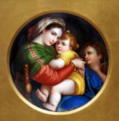 A 19th century Continental porcelain plaque
Enamel painted with Madonna della Sedia, after Raffeallo