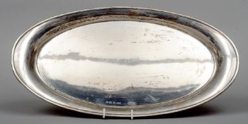 A silver tray, hallmarked Birmingham 1913, maker's mark of G & C Limited
Of oval form with spreading