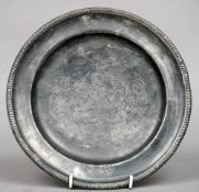 An 18th century Orleans pewter armorial plate
With beaded rim and centrally incised armorial.  21