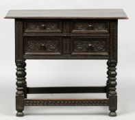 An 18th century and later oak side table
The moulded rectangular top above two carved and