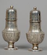 A pair of Victorian silver pepperettes, hallmarked Sheffield 1899, maker's mark of HA
Each of
