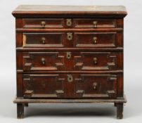 An 18th century oak chest of drawers, of small proportions
The rounded rectangular top above four
