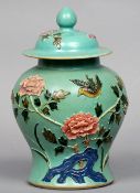 A late 19th/early 20th century Chinese vase and cover
The removable lid above the baluster body