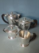 An Art Deco silver plated five piece tea set, in the style of Louis Tardy
Each piece of tapering