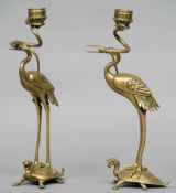 A pair of late 19th century Japanese bronze candlesticks
Each formed as a stork astride a turtle,