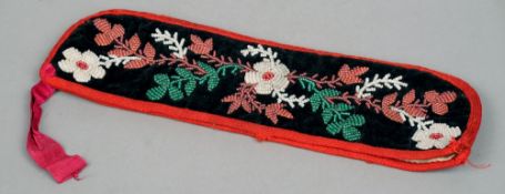 A 19th century American-Indian type bead work pouch
The floral design set on a velvet background.
