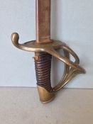 A Belgian Napoleonic period cavalry sword
Of typical form, with a pierced brass hilt.  107 cms long.