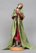 An 18th/19th century Italian creche figure
Typically modelled as a female in flowing robes, standing