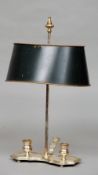 A late 19th century French silver plated Bouillotte lamp
The adjustable tole wear shade supported on