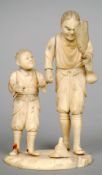 A 19th century Japanese ivory okimono
Formed as two figures, one holding a fan.  13.5 cms high.