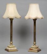 A pair of gilt metal and alabaster Corinthian column table lamps
Each standing on a stepped plinth