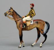 A small cold painted bronze model
Formed as a horse with a jockey up.  5.5 cms wide.   CONDITION