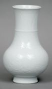 A Chinese Kangxi porcelain Clair de Lune vase
Of baluster form, the tall spreading neck engraved