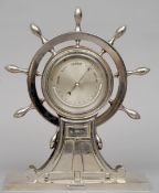 A 19th century chromed desk top barometer by or retailed by Betjemann
Formed as a ship's wheel, on