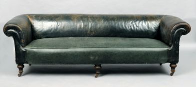 A Victorian leather upholstered Chesterfield settee
The scrolling arms and back above the