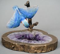 An unmarked silver gilt mounted amethyst and porcelain model of a kingfisher
The porcelain bird