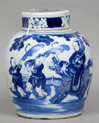 A Chinese Kangxi blue and white ginger jar
Decorated with a figure of a dignity astride a dog-of-fo.