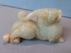 A Chinese carved jade mythical beast
10 cms long.   CONDITION REPORTS:  Generally in good condition,