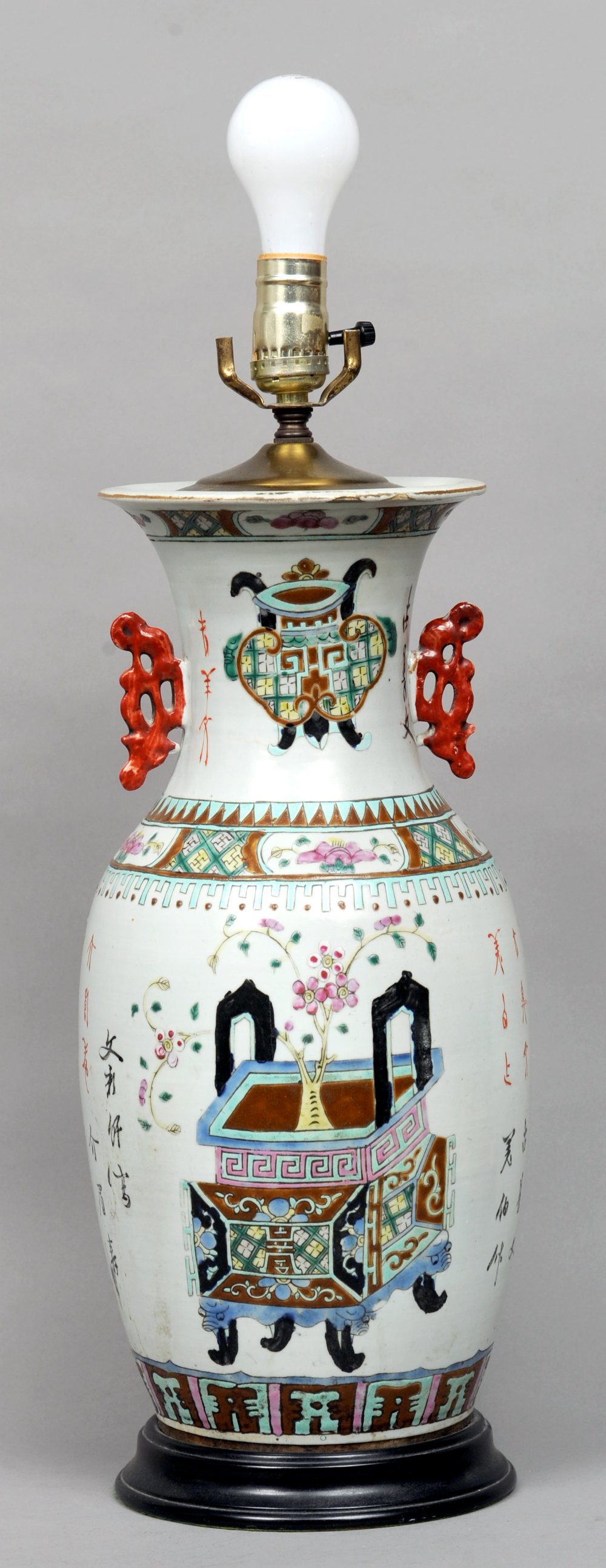 A 19th century Chinese porcelain vase
The flared rim above twin pierced handles, the main body