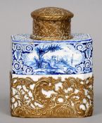 A 19th century Delft blue and white tea caddy
Of canted rectangular form, decorated with vignettes