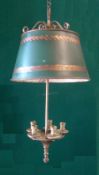 A gilt metal hanging candle lamp
With five sconces and decorated tole ware adjustable shade.  74 cms