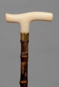 A Victorian ivory handled carved bamboo walking cane
The ivory handle above the engraved unmarked