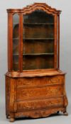 A 19th century Dutch marquetry inlaid display cabinet
The upper section with moulded arched