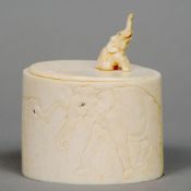 A late 19th/early 20th century Oriental ivory tusk section box
With incised elephant decoration, the