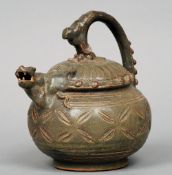 A 19th century Chinese celadon ground wine ewer
With scrolling handle and dragon form spout.  16 cms