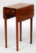 A small George III mahogany Pembroke table
The rounded rectangular twin flap top above a single