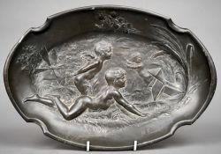 An Art Nouveau pewter dish
Centrally decorated with cherubs and putto in a landscape, the rim