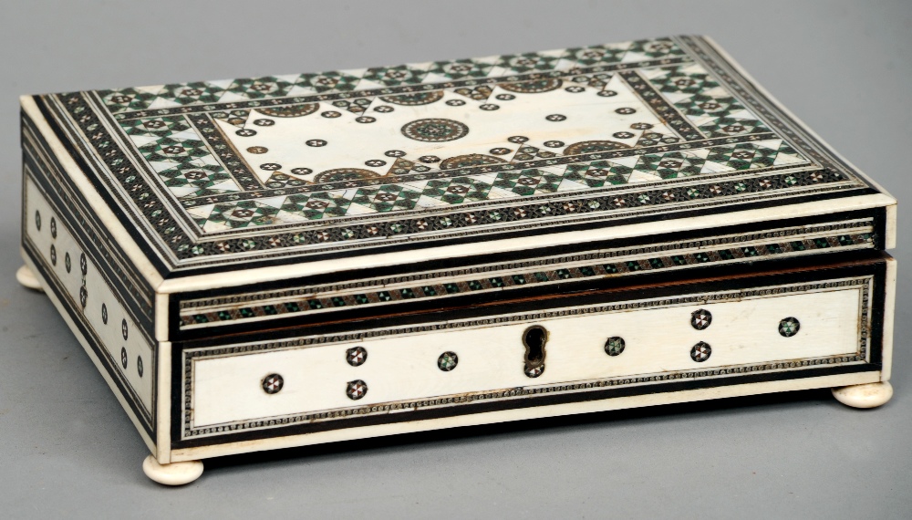 A late 19th century Anglo-Indian ivory Vizagapatam box
Of rectangular form, typically decorated,